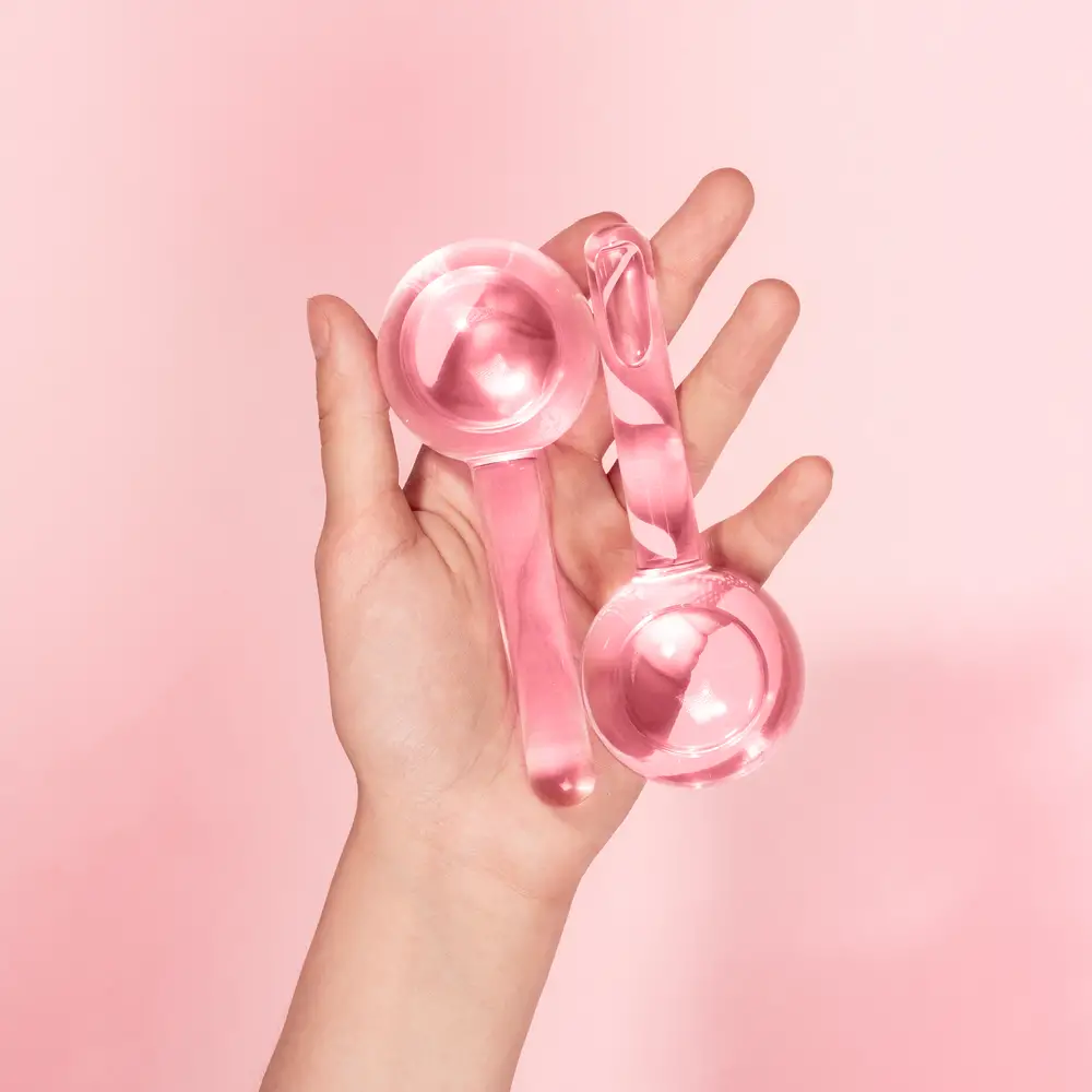 pink ice rollers in womans hands