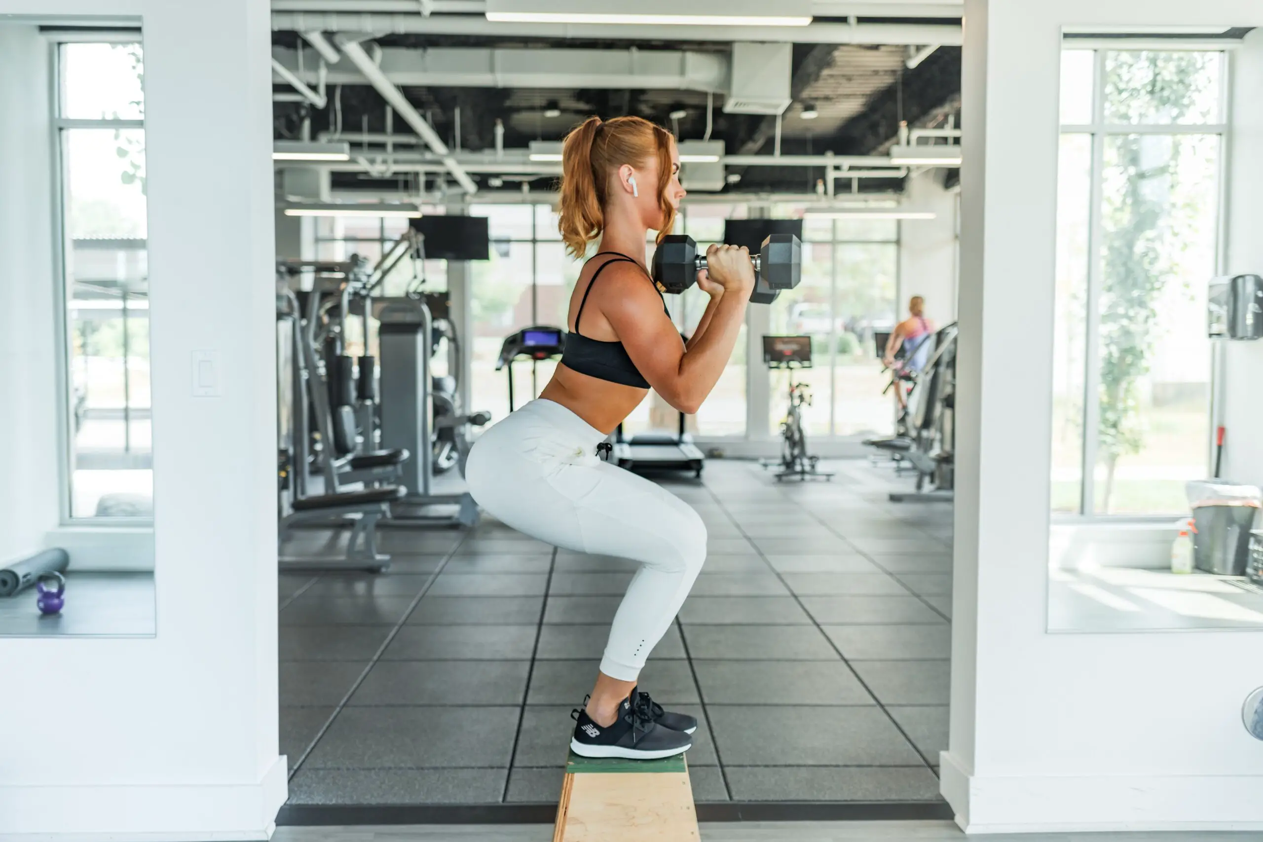 Woman Performing Weighted Squat